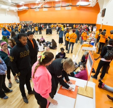 Picture of students signing up for community service day